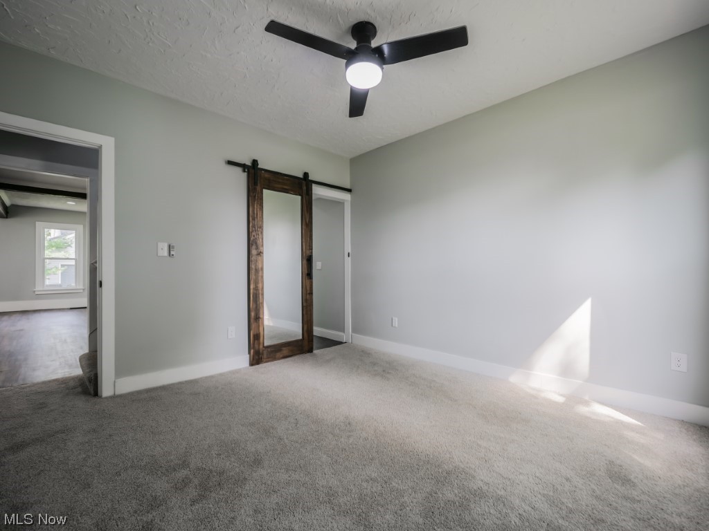 39330 Chestnut Ridge Road Elyria, OH 44035 - Photo 24 of 32 Carpeted bedroom with a textured ceiling and ceiling fan