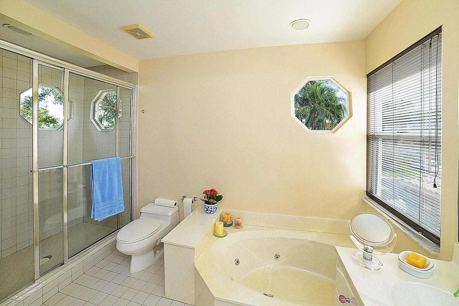 6695 Northwest 25th Court Boca Raton, FL 33496 - Photo 20 of 40 a bathroom with a sink a toilet and shower