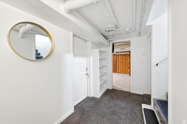 676 South 500 West Provo, UT 84601 - Photo 20 of 29 Hallway with dark carpet and baseboards