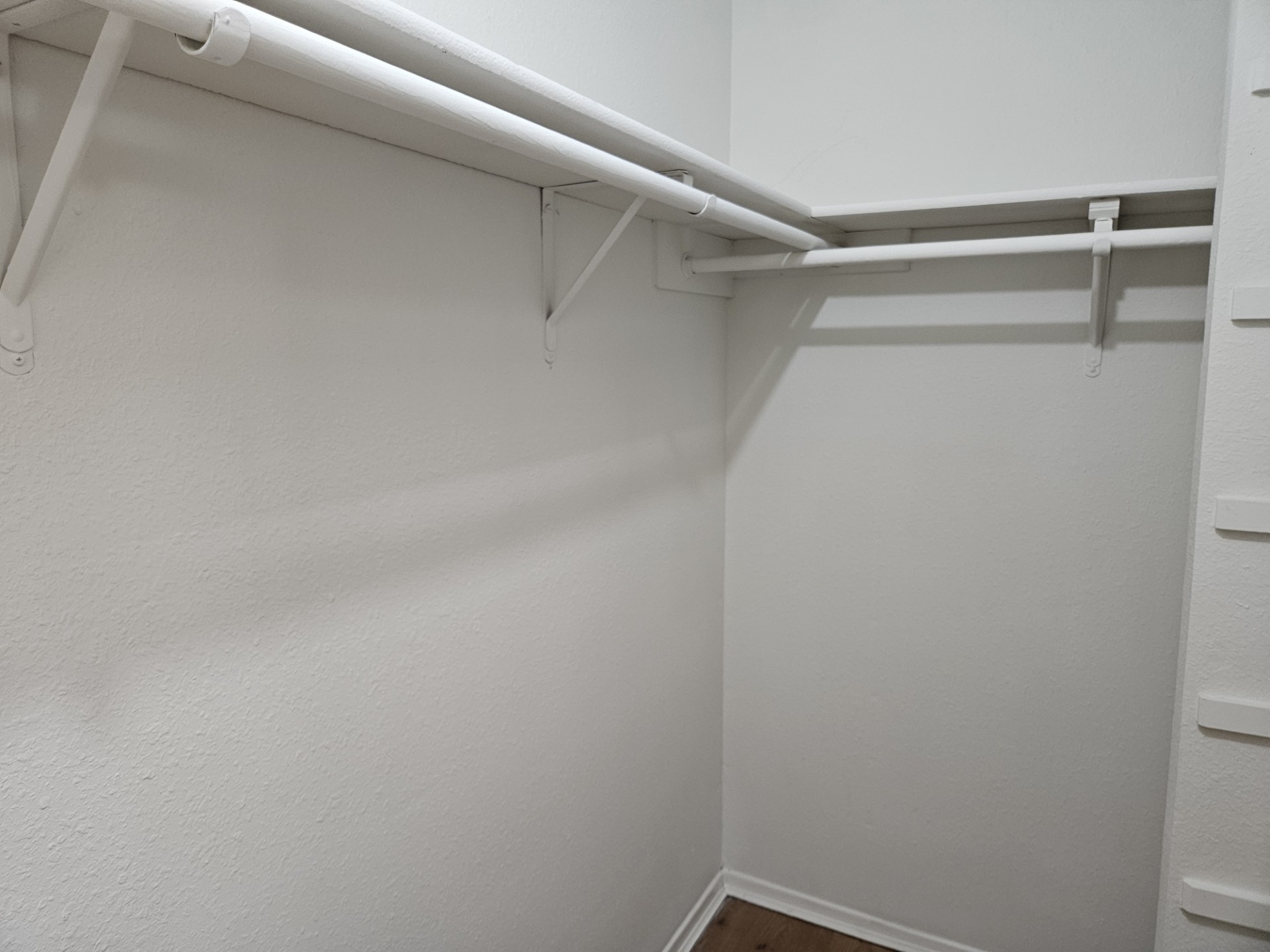 805 Lexington Road, Unit B Elgin, TX 78621 - Photo 5 of 11 Functional shelving and hanging space maximize storage in this well-appointed closet.