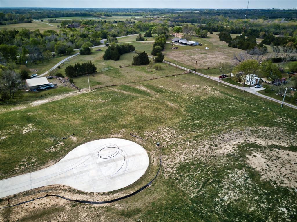 Tbd Tbd Hidden Hills Anna, TX 75409 - Photo 8 of 11 an aerial view of a house with a yard