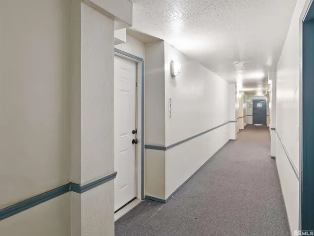 a view of a hallway with a room