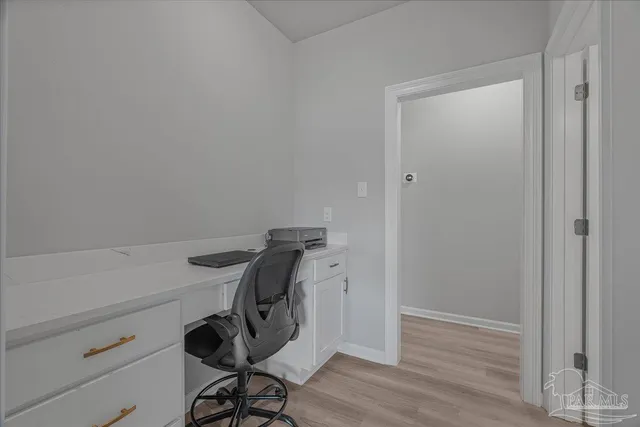 a view of a workspace with furniture