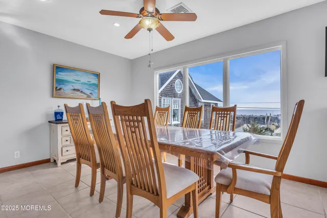 a kitchen with stainless steel appliances granite countertop a sink a stove and a wooden floors