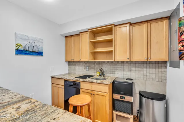 a spacious bathroom with a double vanity sink a mirror and a shower