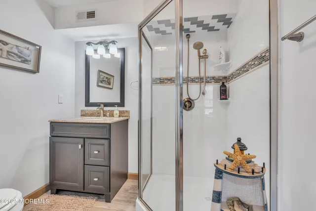 a view of a roof deck with chair and tables