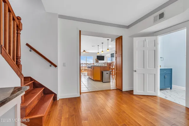 a view of entryway with wooden floor