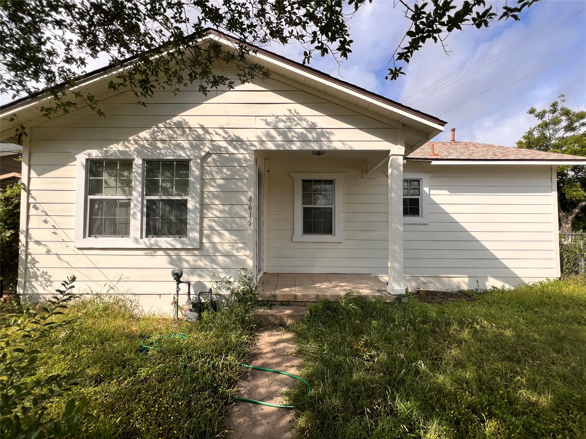 4615 Ribbecke Avenue Austin, TX 78721 - Photo 1 of 19 A charming single-story home with a welcoming front porch and mature tree canopy.