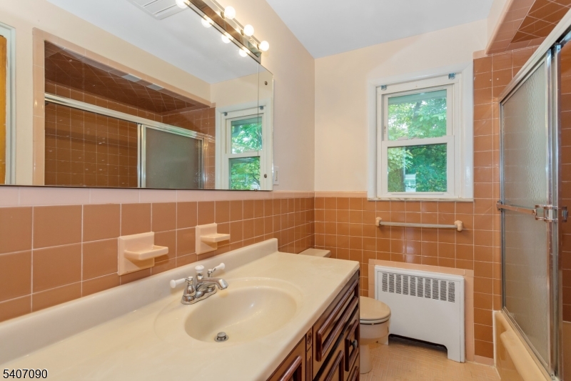 3 Mulberry Terrace Kinnelon, NJ 07405 - Photo 14 of 38 a bathroom with a sink and a bathtub