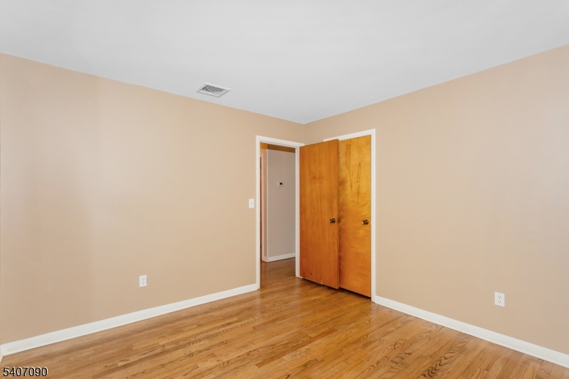 3 Mulberry Terrace Kinnelon, NJ 07405 - Photo 17 of 38 a view of an empty room with wooden floor