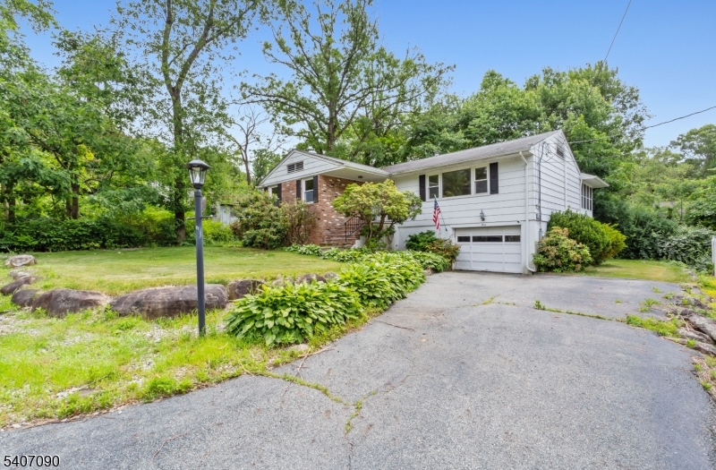 3 Mulberry Terrace Kinnelon, NJ 07405 - Photo 2 of 38 a front view of a house with a yard and an tree