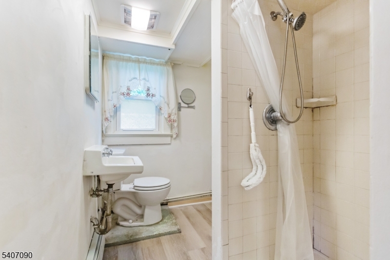 3 Mulberry Terrace Kinnelon, NJ 07405 - Photo 25 of 38 a bathroom with a toilet sink and shower curtain