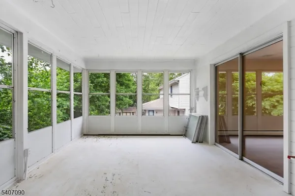 a view of an empty room with a large window