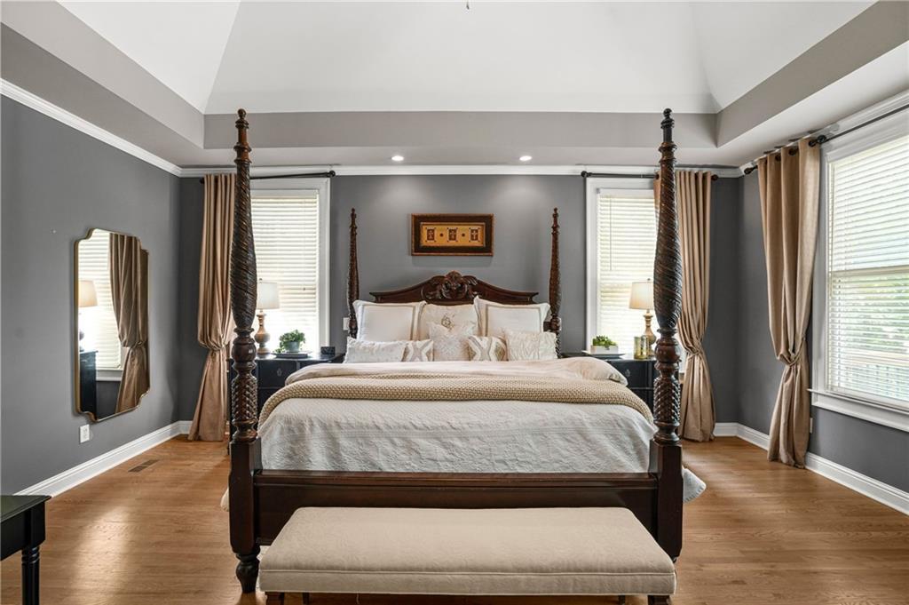 509 Crested Hawk Ridge Canton, GA 30114 - Photo 27 of 89 a bedroom with a large bed and a window