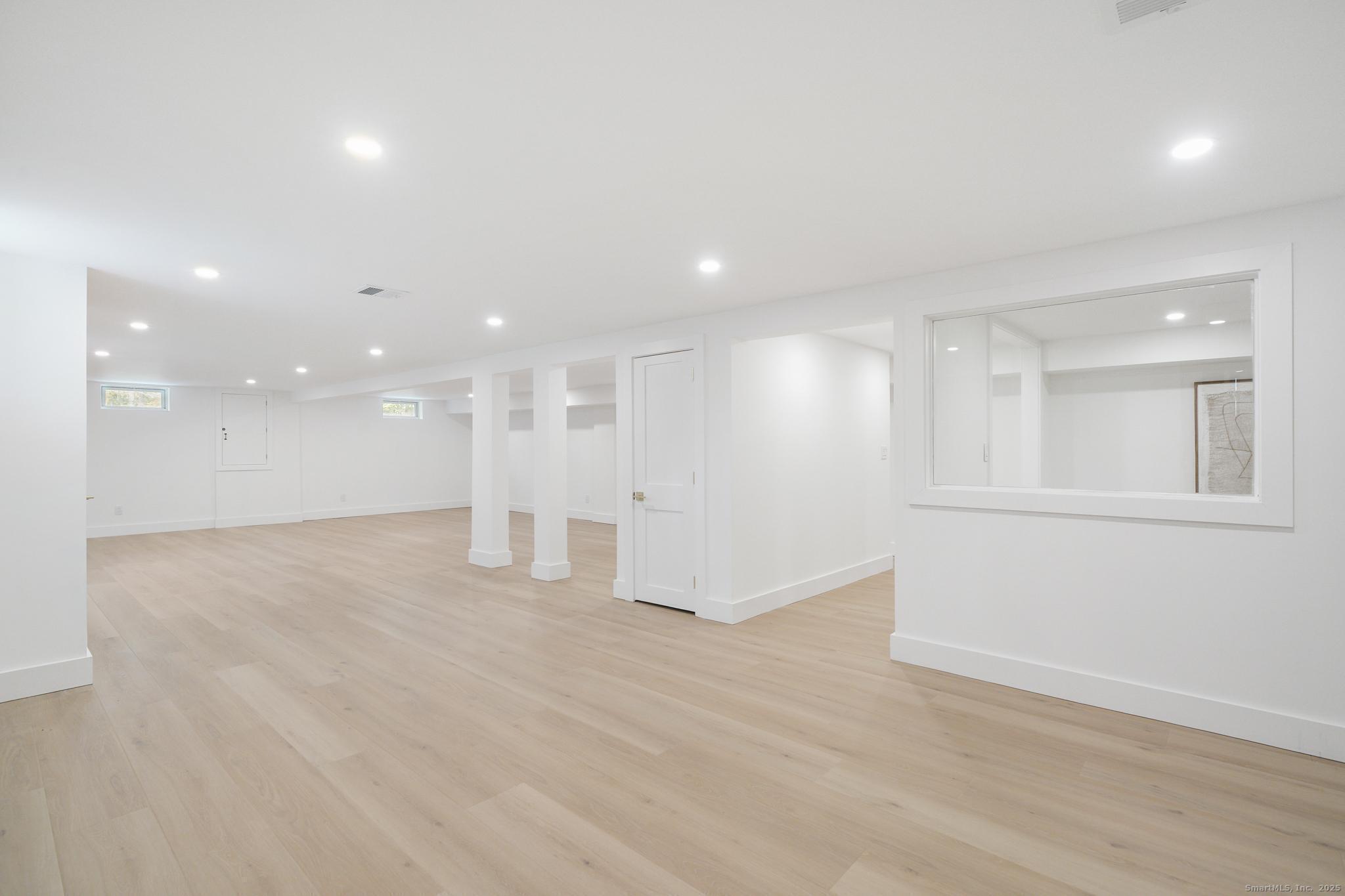 55 Liberty Street Wilton, CT 06897 - Photo 14 of 23 a view of an empty room with wooden floor