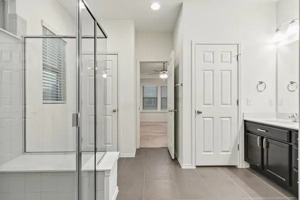 a bathroom with a shower and a sink