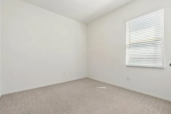 a view of storage and utility room with wooden floor