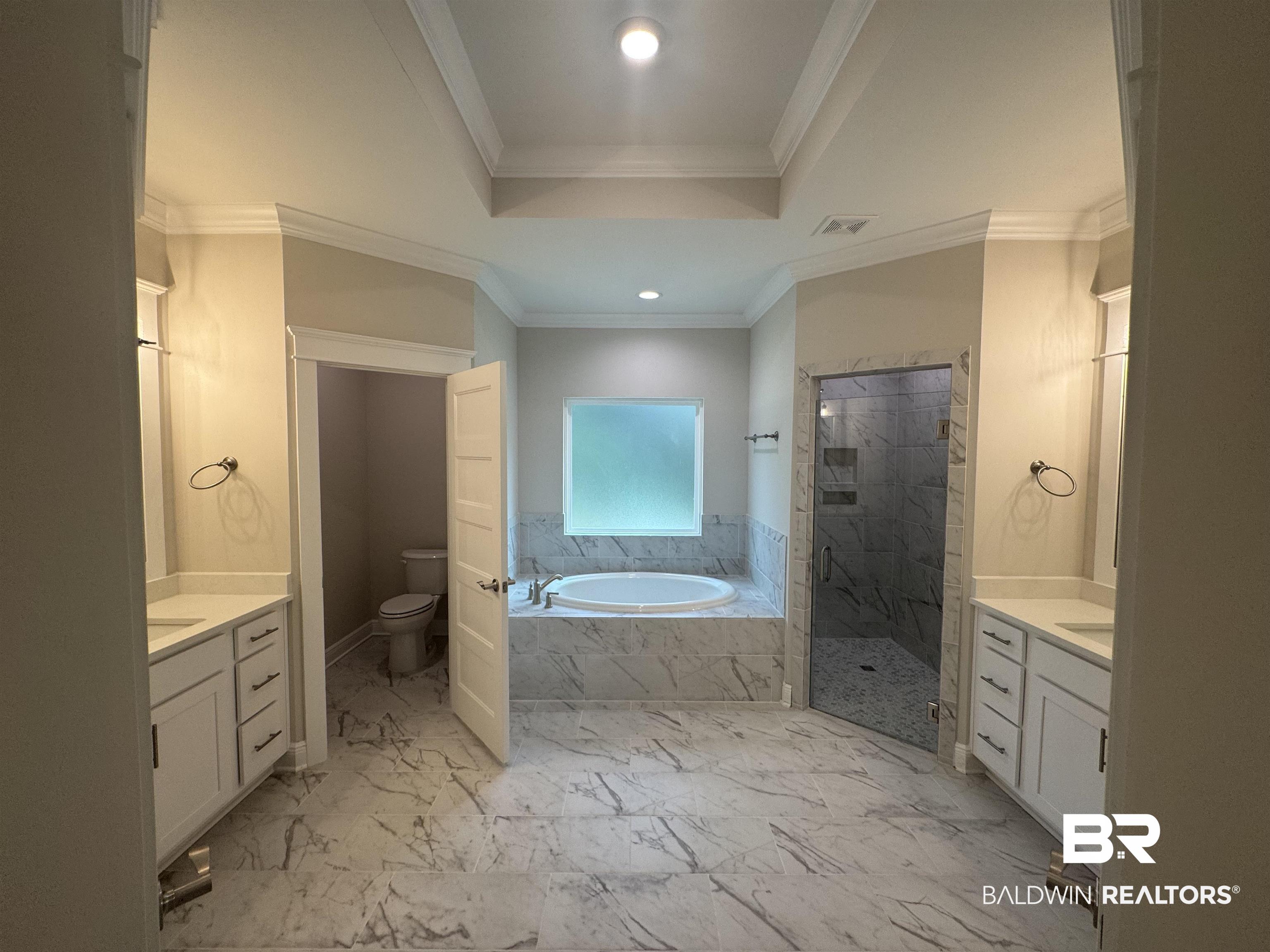 8090 Calverton Street, Unit 23 Foley, AL 36535 - Photo 17 of 30 Full bathroom with ornamental molding, separate shower and tub, and toilet