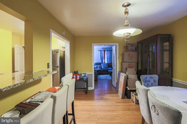 a very nice looking room with a large window and chandelier