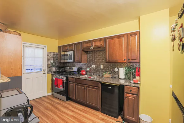 a kitchen with a sink cabinets and appliances