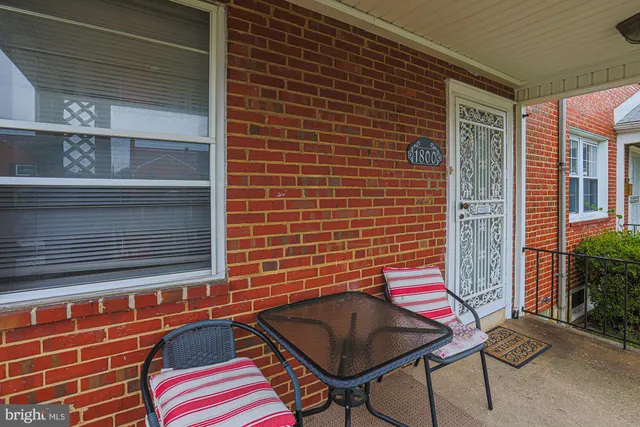 a view of a house with a small backyard