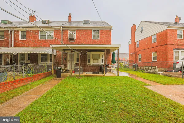 a view of a building with a yard