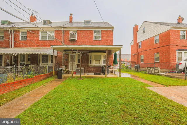 a view of a building with a yard