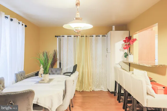 a dining room with a table and chairs