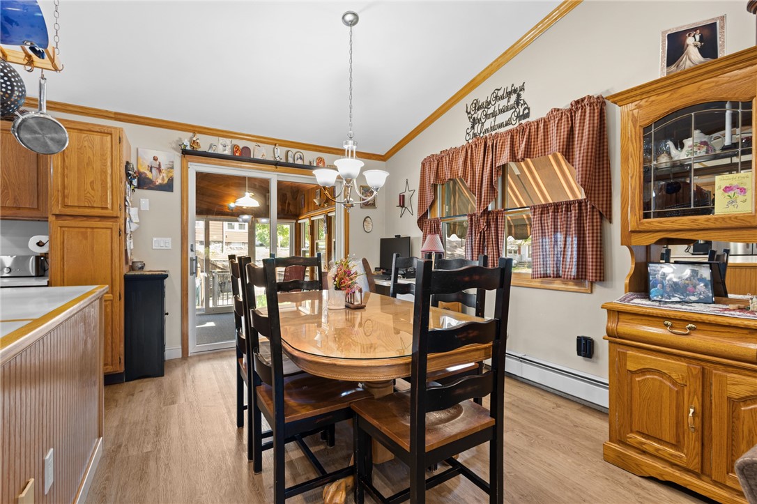 11 Bourassa Avenue Woonsocket, RI 02895 - Photo 11 of 39 Dining area with sliding glass doors to sunroom/4-season room