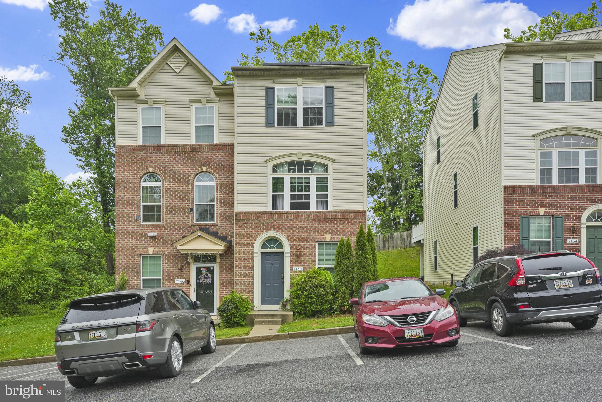 7138 Station House Road Elkridge, MD 21075 - Photo 5 of 42 a car parked in front of a house