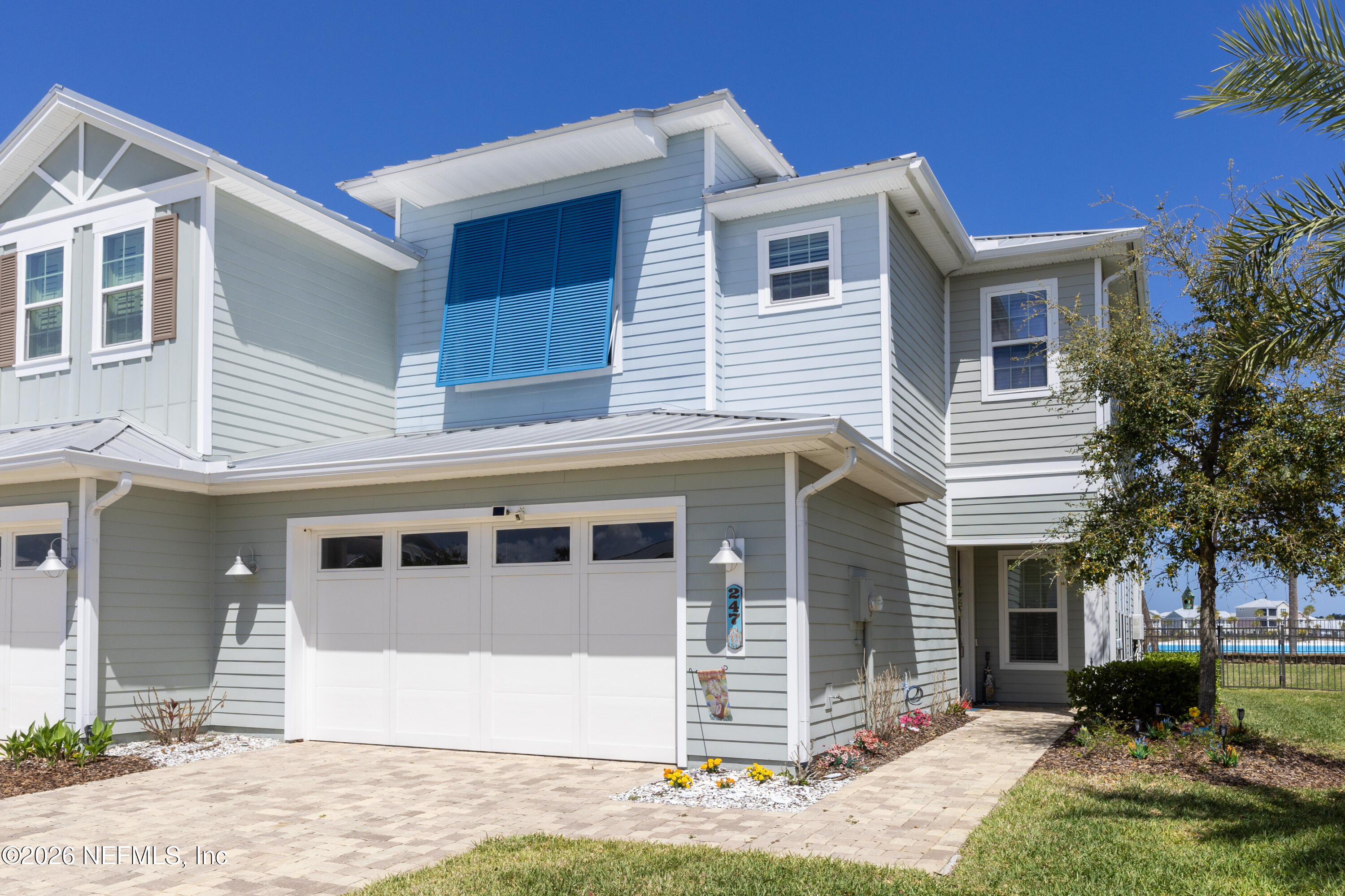 247 Rum Runner Way St. Johns, FL 32259 - Photo 1 of 42 a front view of a house with a yard and garage