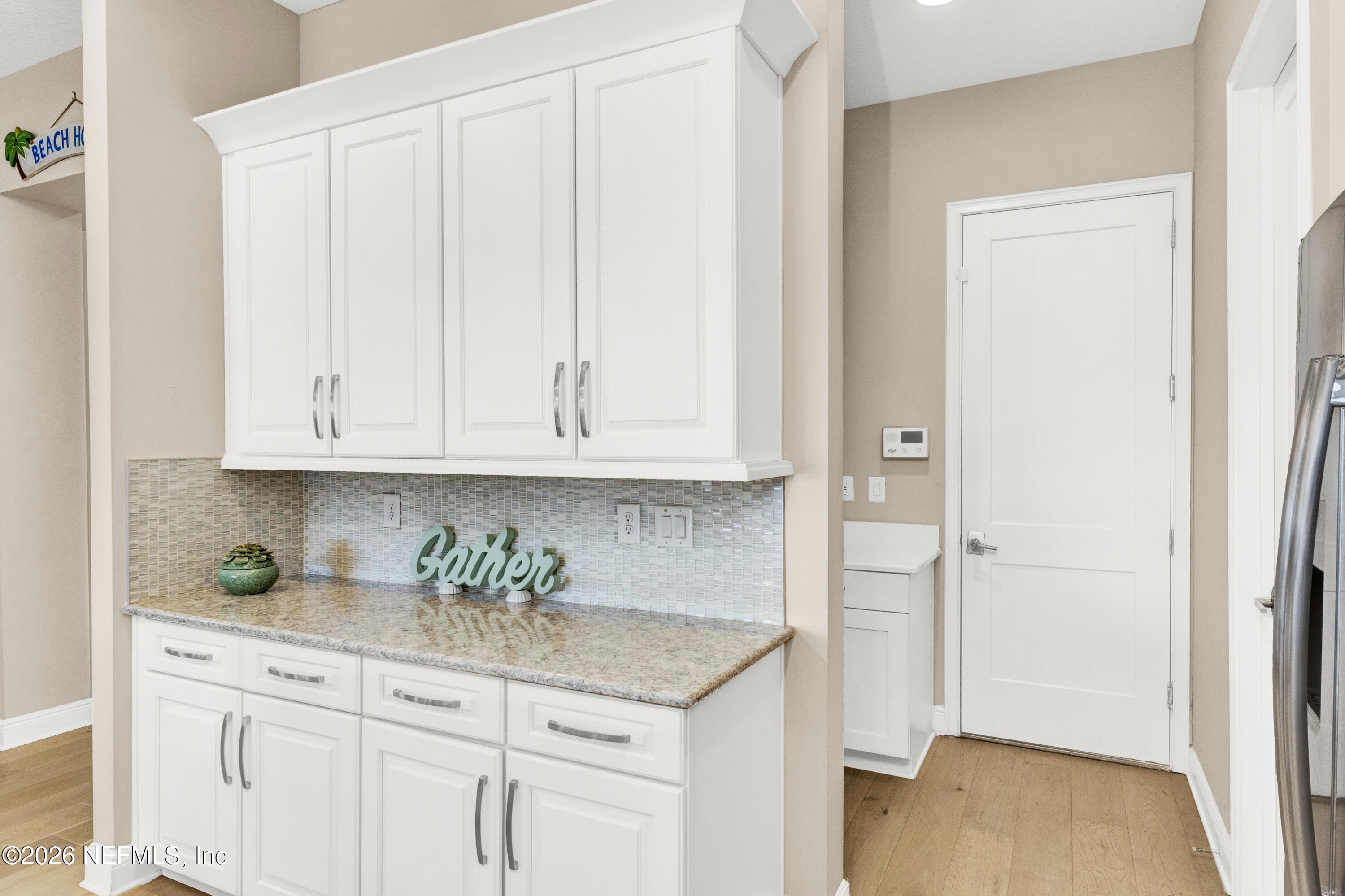 247 Rum Runner Way St. Johns, FL 32259 - Photo 11 of 42 a kitchen with granite countertop white cabinets and a sink
