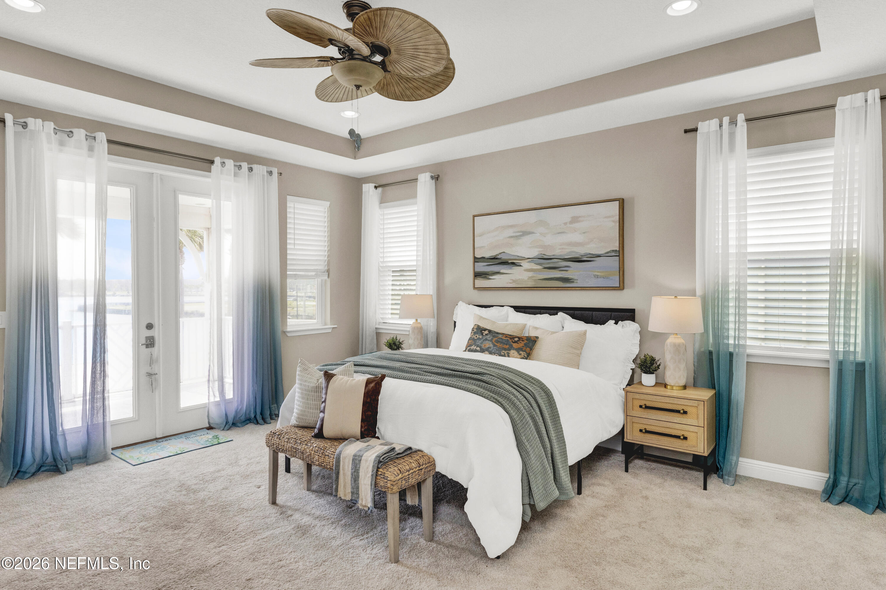 247 Rum Runner Way St. Johns, FL 32259 - Photo 16 of 42 a bedroom with a bed painting on wall and a large window