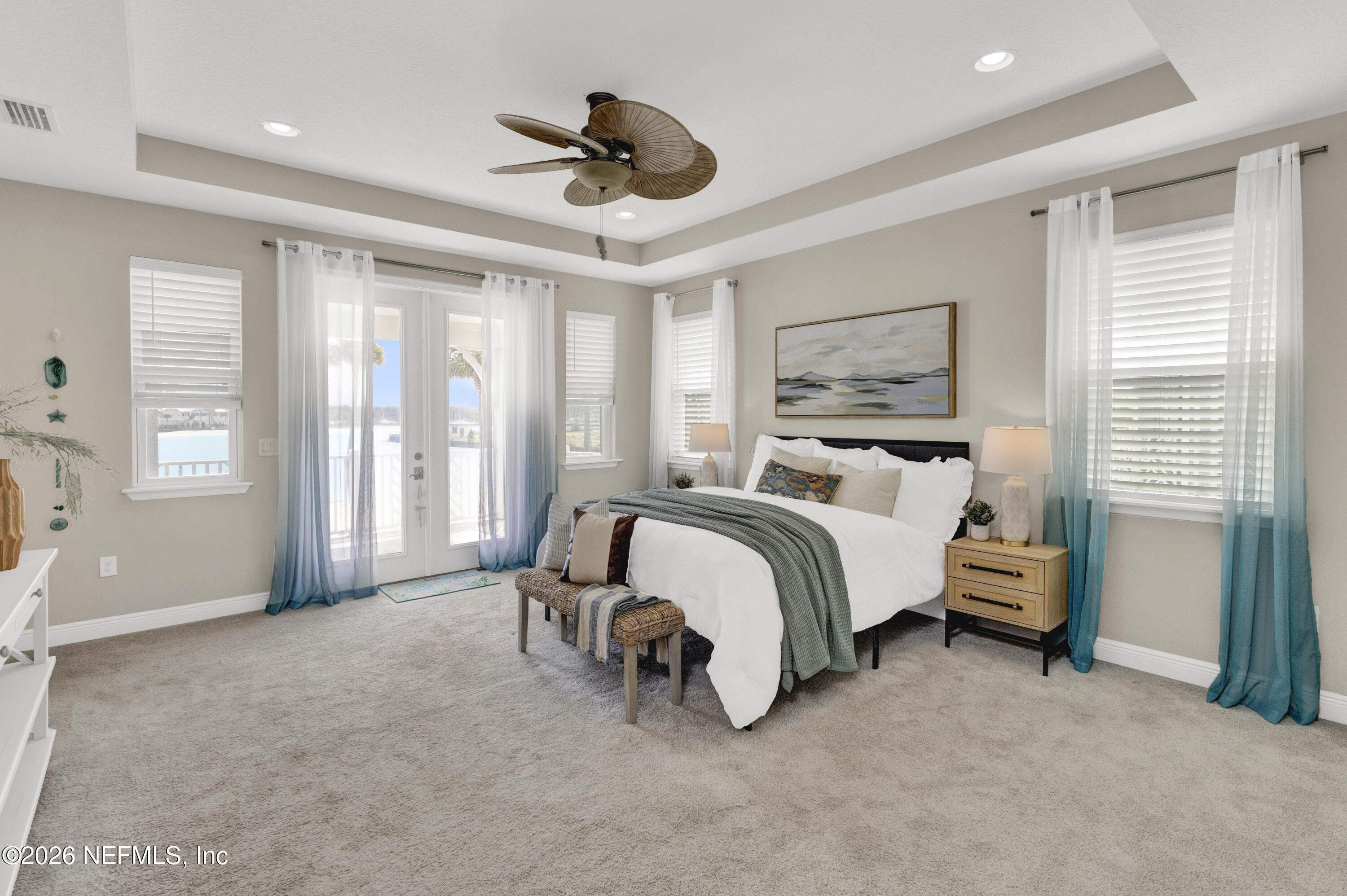 247 Rum Runner Way St. Johns, FL 32259 - Photo 17 of 42 a bedroom with a bed and a chandelier