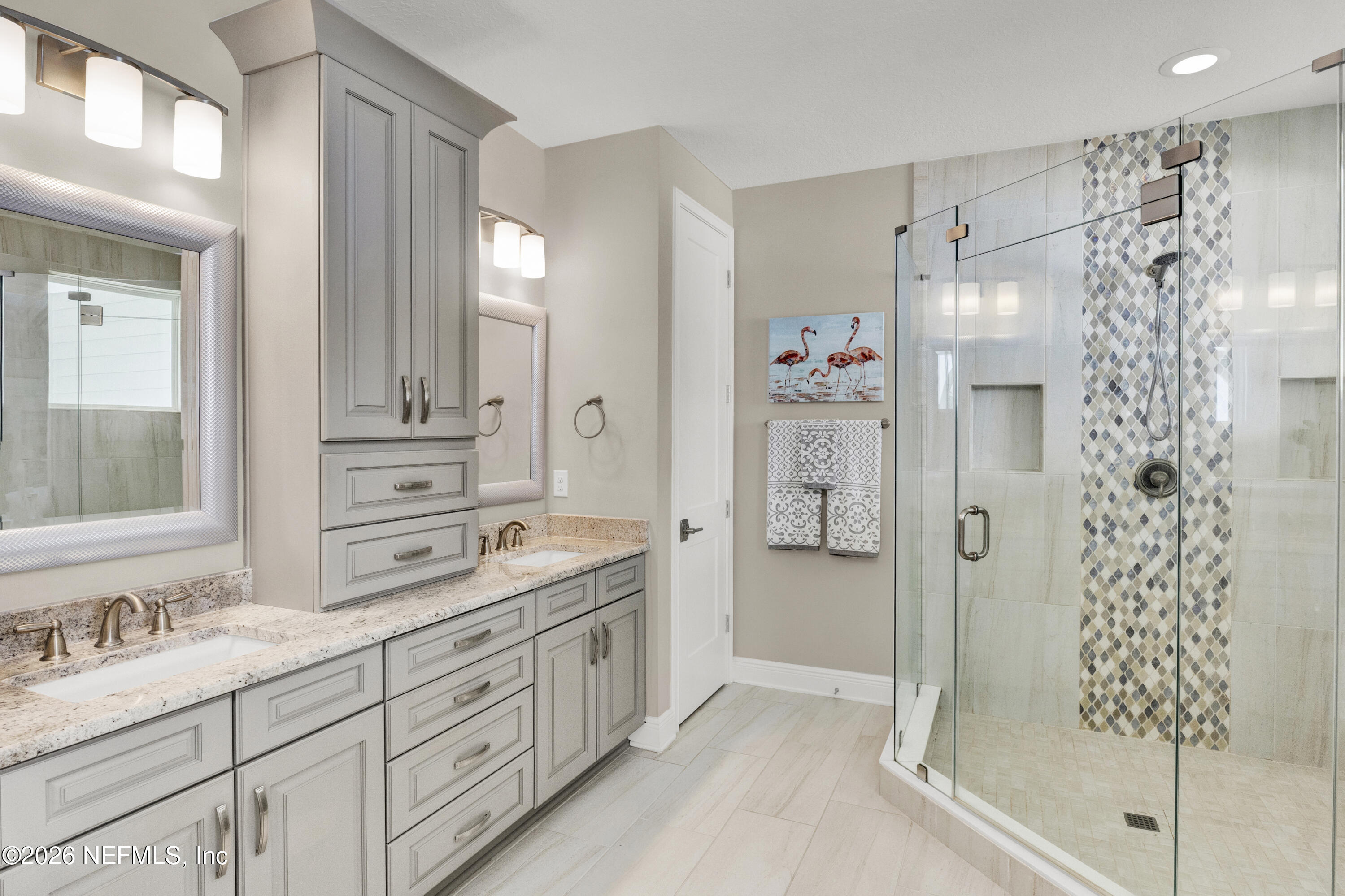 247 Rum Runner Way St. Johns, FL 32259 - Photo 19 of 42 a spacious bathroom with a shower sink and mirror