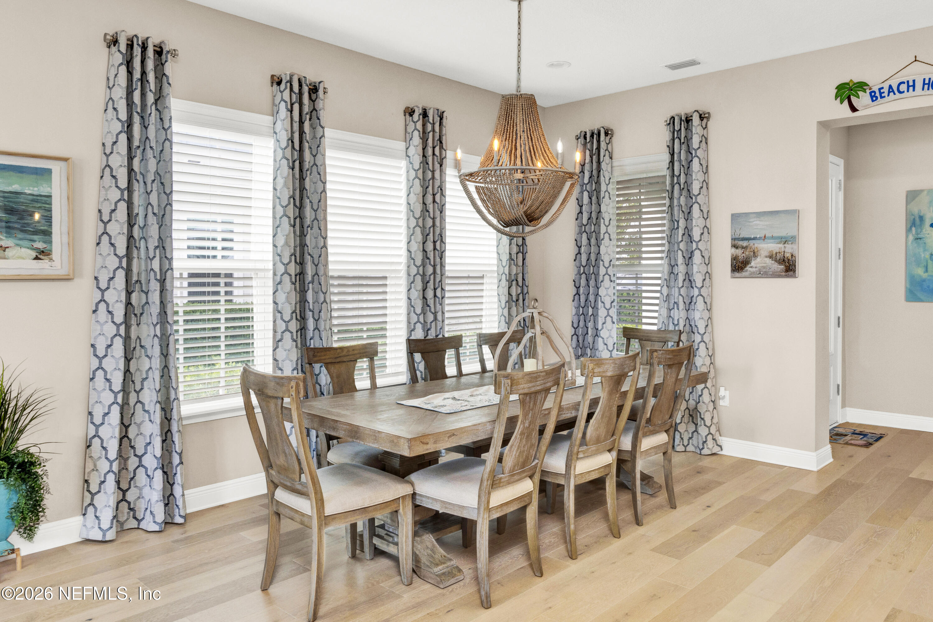247 Rum Runner Way St. Johns, FL 32259 - Photo 5 of 42 a view of a dining room with furniture window and wooden floor