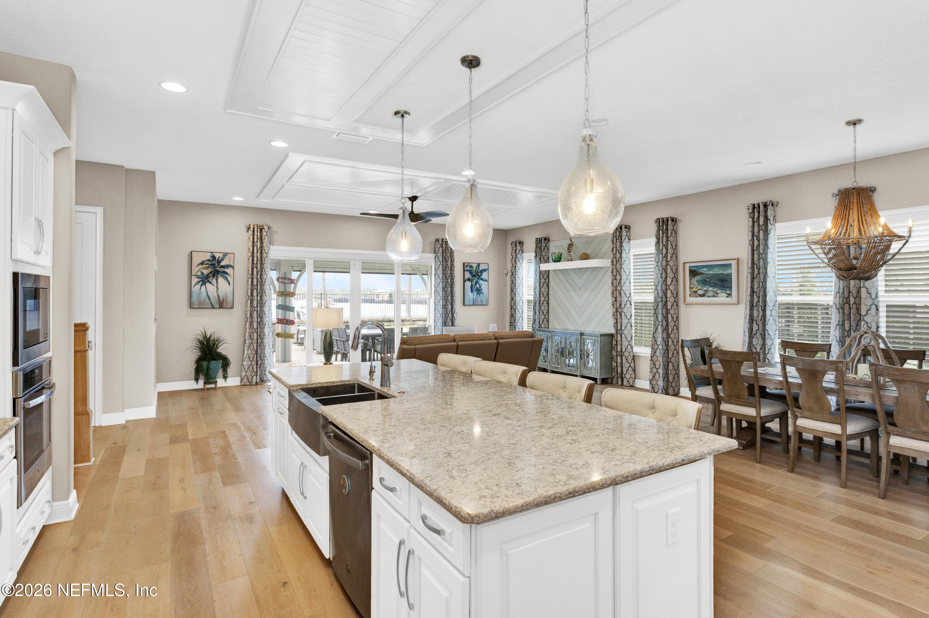 247 Rum Runner Way St. Johns, FL 32259 - Photo 7 of 42 a kitchen with stainless steel appliances granite countertop a kitchen island a stove and a sink