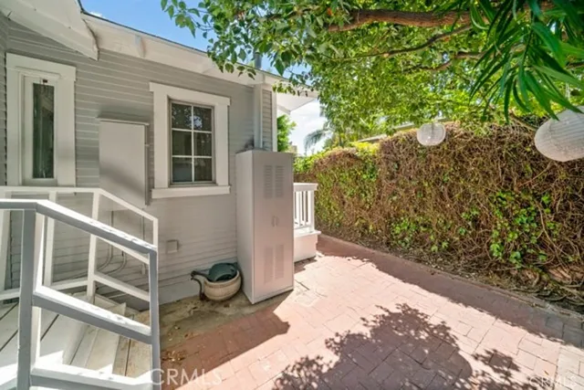 a front view of a house with a yard and fountain