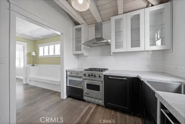 a kitchen with stainless steel appliances granite countertop a stove and a sink