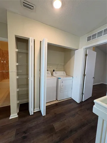 a view of entryway with wooden floor