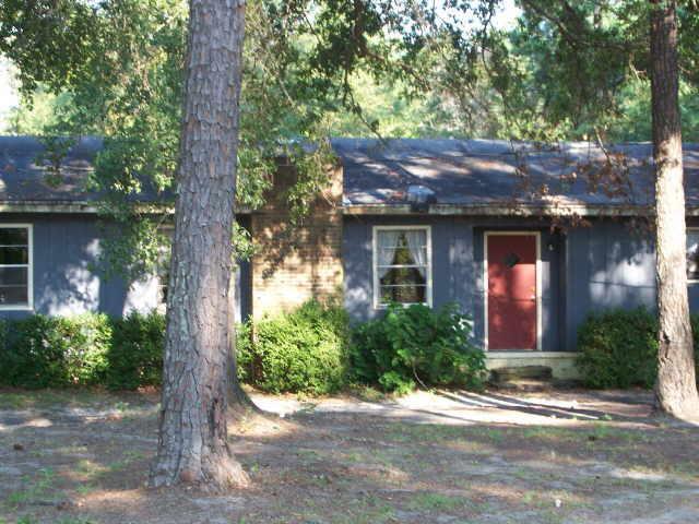 10960 St Mathews Church Road Metter, GA 30439 - Photo 1 of 1 a front view of a house with garden
