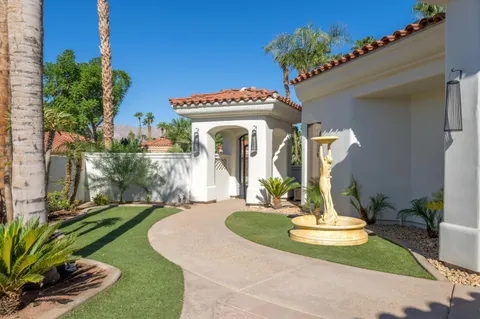 a kitchen with stainless steel appliances granite countertop a stove a refrigerator and a stove