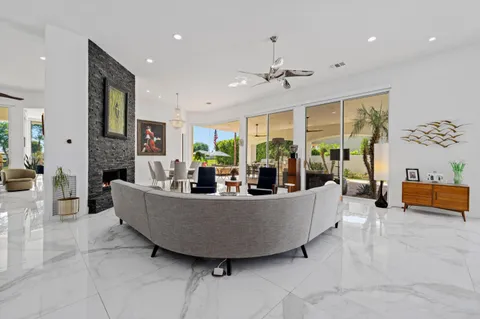 a bathroom with a double vanity sink toilet and shower