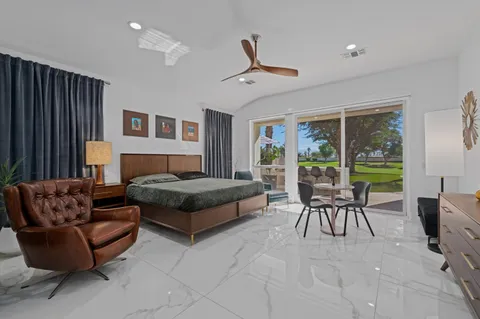 a front view of a house with swimming pool having outdoor seating