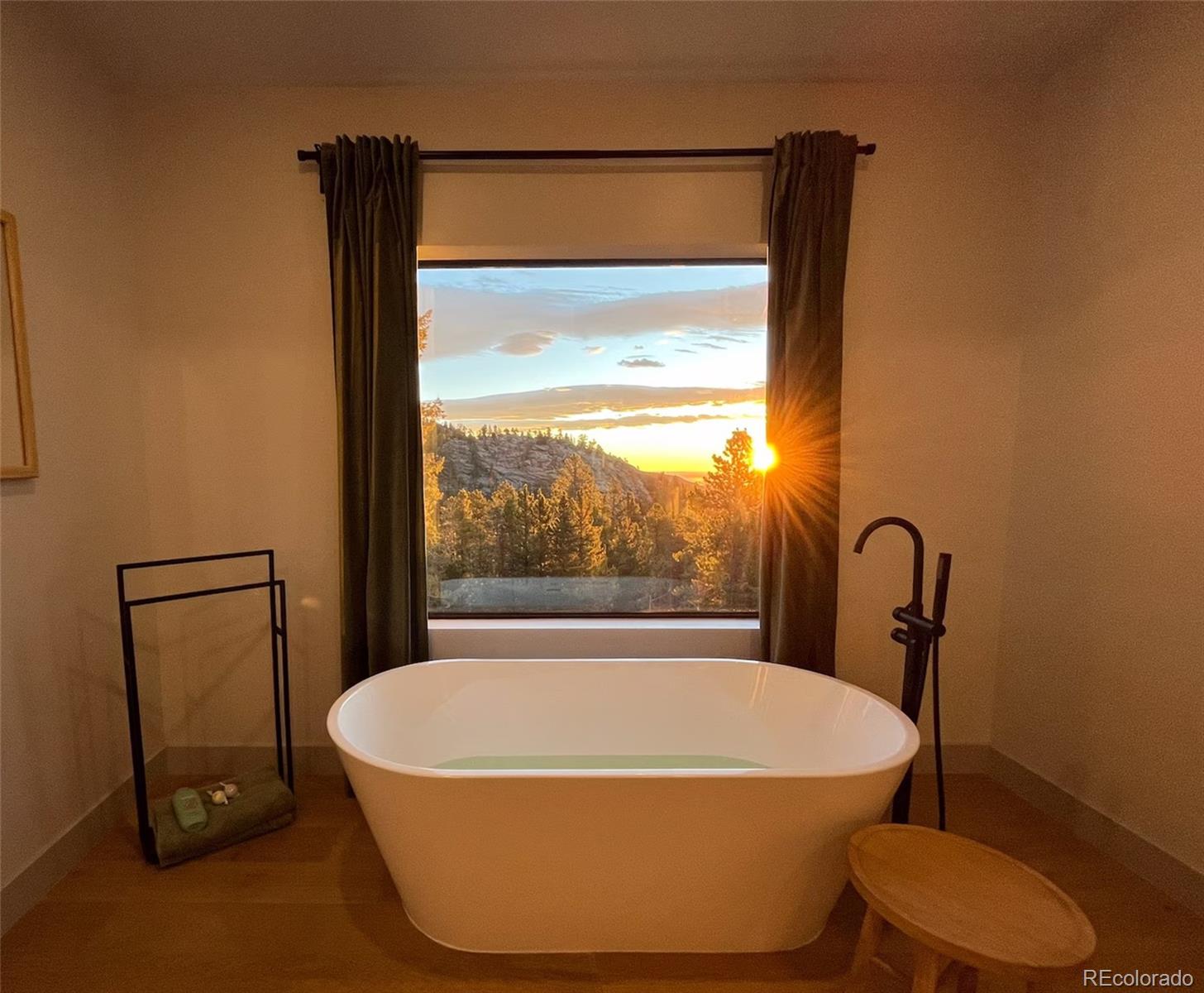 311 Pioneer Road Golden, CO 80403 - Photo 11 of 47 a white bath tub sitting next to a window