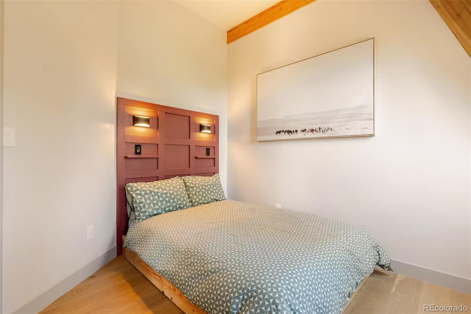 311 Pioneer Road Golden, CO 80403 - Photo 12 of 47 a bedroom with a bed and mirror
