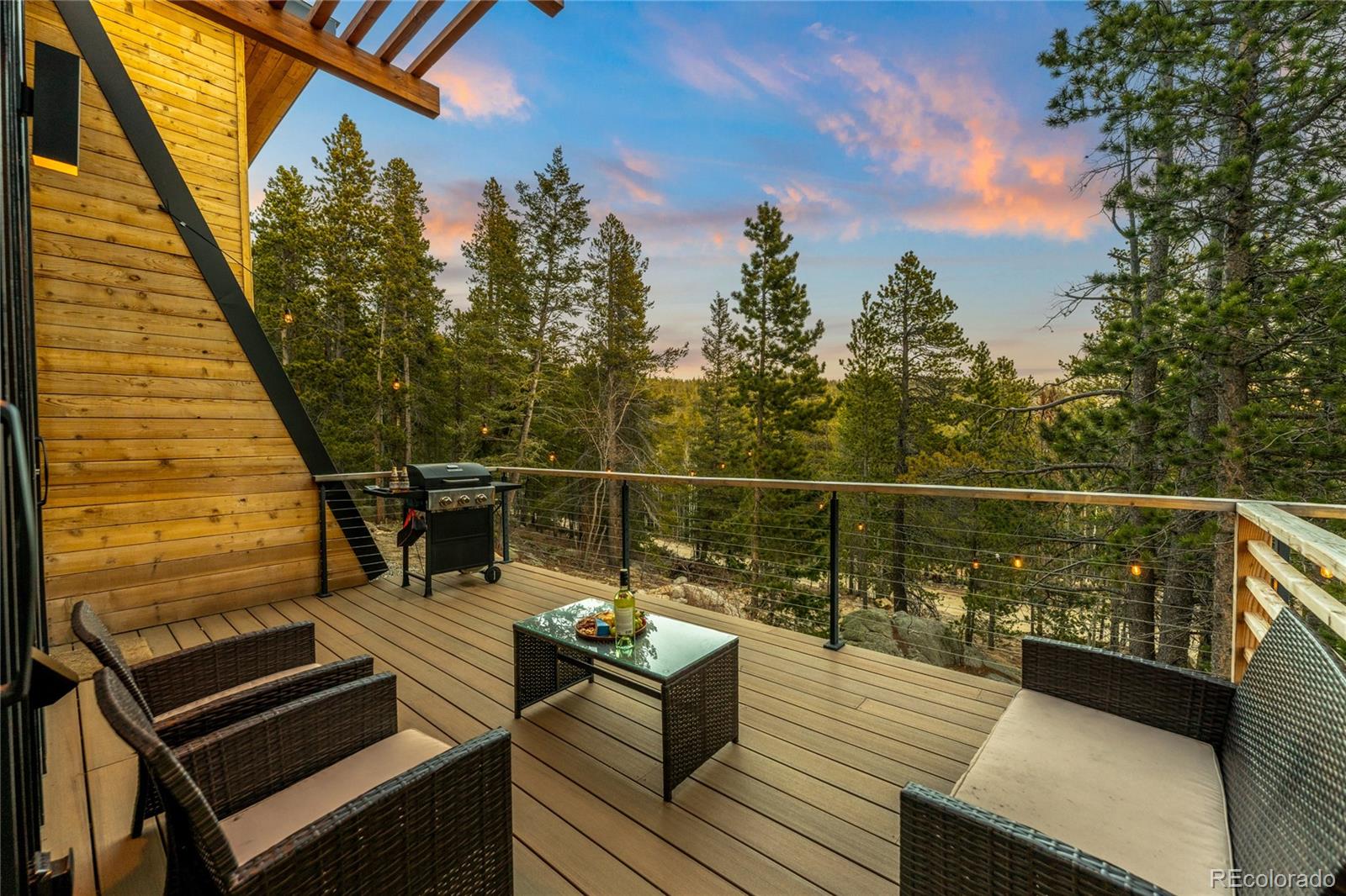 311 Pioneer Road Golden, CO 80403 - Photo 13 of 47 a view of a balcony with wooden floor and outdoor seating