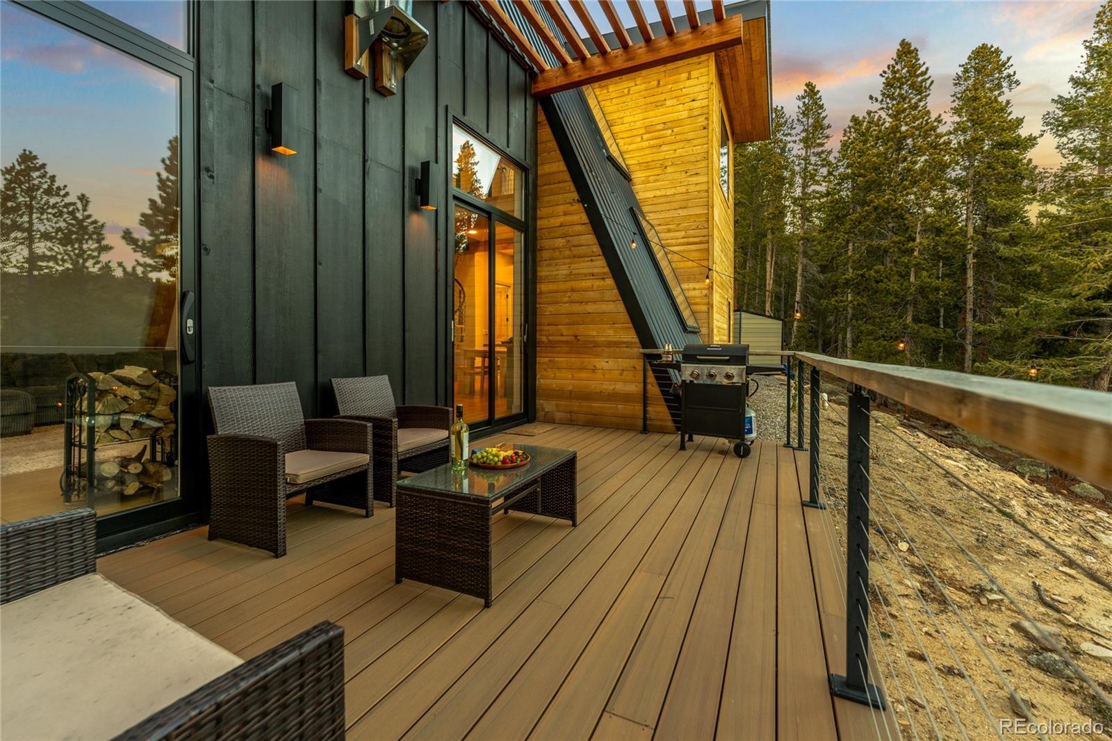 311 Pioneer Road Golden, CO 80403 - Photo 14 of 47 a view of balcony with chairs and wooden floor