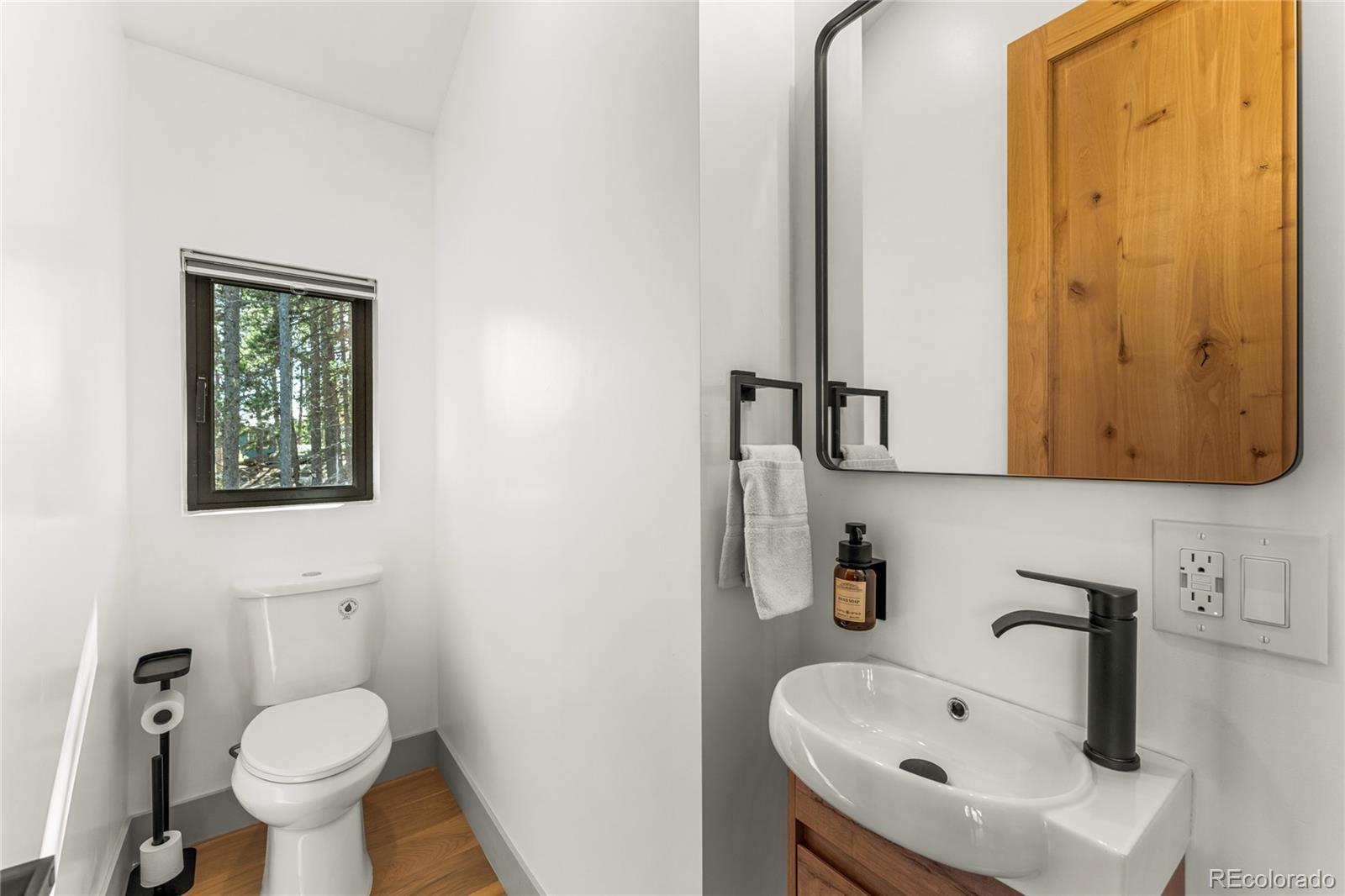 311 Pioneer Road Golden, CO 80403 - Photo 37 of 47 a bathroom with a sink and a toilet