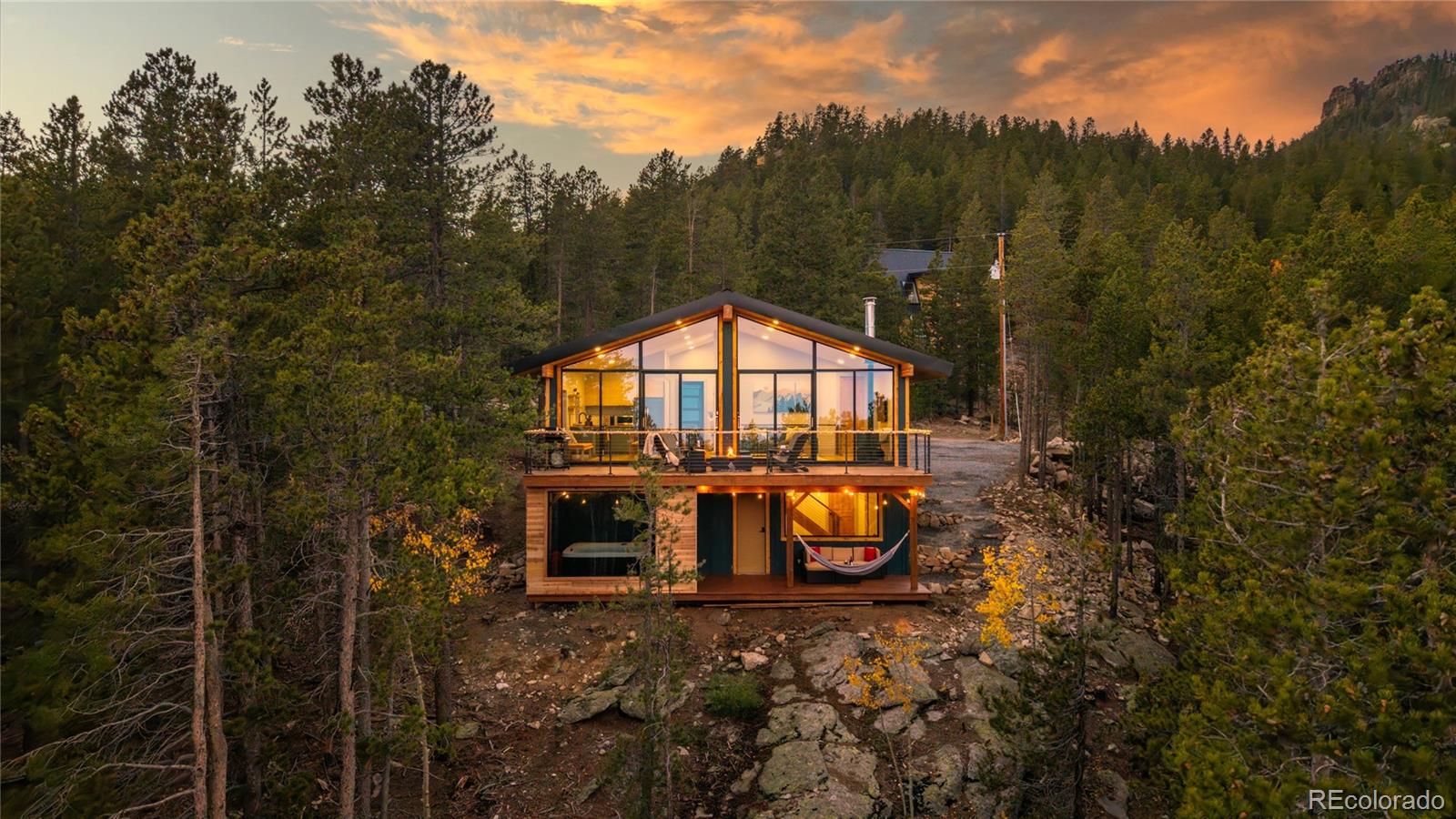 311 Pioneer Road Golden, CO 80403 - Photo 43 of 47 a view of a house with backyard and trees